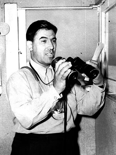 
                    Joe Hernandez prepares to call the 1950 Kentucky Derby live for Churchill Downs fans. His call of the race was recorded and copies were eventually distributed to more than 60,000 racing fans.
                                            (Courtesy Caballo Press of Ann Arbor and Frank Hernandez. All rights reserved.)
                                        