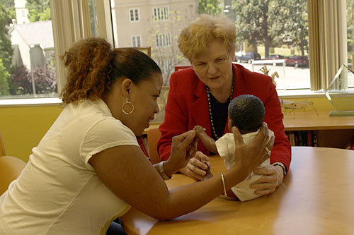 
                    Mary Jane Rotheram-Borus uses a doll to explain a point about parenting skills.
                                            (UCLA Center for Community Health)
                                        