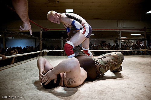 
                    Wrestlers of the South Broadway Athletic Club in St. Louis, Miss., do battle in the ring.
                                            (Jay Fram)
                                        
