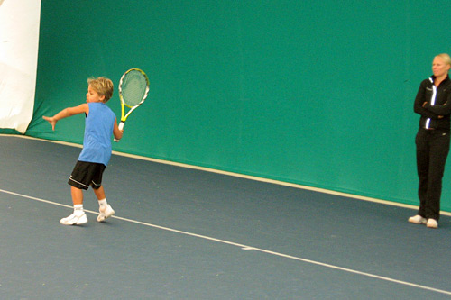 
                    Six-year-old Jan Silva practices his stroke during one of his daily private tennis lessons.
                                            (Rene Gutel)
                                        