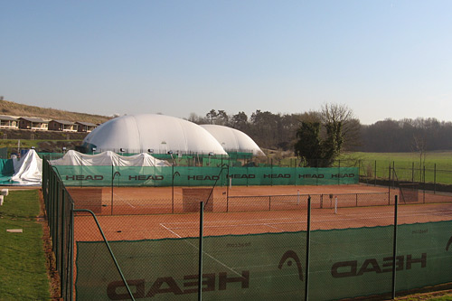 
                    The outdoor tennis courts at the Mouratoglou Tennis Academy outside Paris are covered in giant white tents in the winter.
                                            (Rene Gutel)
                                        