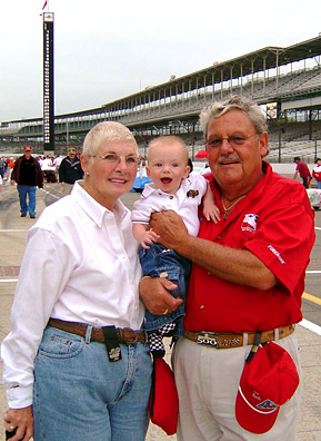 
                    May, 2004: Art and Kathy Koch at the Indianapolis Motor Speedway with grandson Cam "Camshaft" Wade.
                                            (Courtesy Art Koch)
                                        