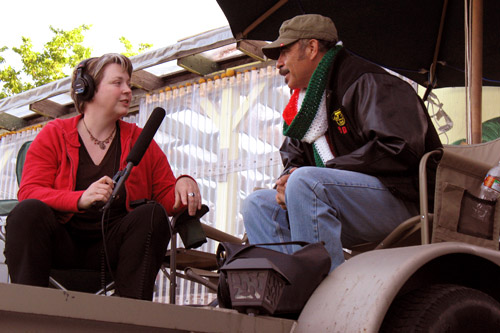 
                    Julia Barton speaks with Jose Granados at the Scarborough Faire performers' campground.
                                            (Greg Barton)
                                        