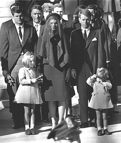 
                    Members of the Kennedy clan watch the funeral procession for assassinated President John F. Kennedy, Nov. 26, 1963.
                                            (AFP/Getty Images)
                                        