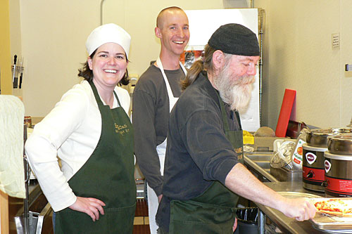 
                    Brad and Libby Birky share the kitchen with an unnamed customer. "We offer folks the opportunity to volunteer here at the cafe, so anybody who wants to can take a few minutes," Brad Birky says.
                                            (Courtesy Brad Birky)
                                        