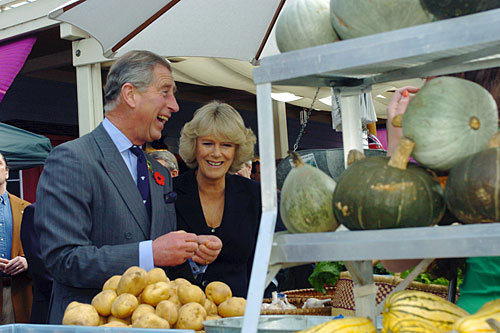 
                    Prince Charles and wife Camilla, Duchess of Cornwall, share a laugh as they tour the West Marin Farmer's Market during a visit to Point Reyes in 2005. The prince is a prominent advocate of organic farming techniques.
                                            (Frankie Frost-Pool/Getty Images)
                                        