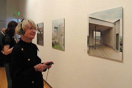 
                    A museum patron listens to other patrons critique a work of art using the "Round" device.
                                            (Courtesy Halsey Burgund)
                                        