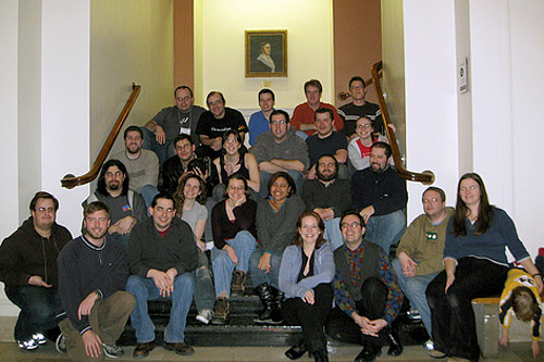
                    The team "Evil Midnight Bombers What Bomb at Midnight" gather 20 minutes after winning the 2008 MIT Mystery Hunt. Weekend America guest Dan Katz is in the second row from the top, second in from the left, and Francis Heaney is in the bottom row, third from right.
                                            (Lorinne Lampert)
                                        