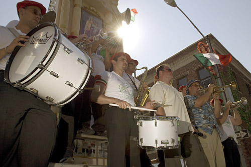 
                    Balancing on top of the Giglio platform is a ten person band, singer and MC. The Festival of San Paolino de Nola in Brookyn has the only Giglio in America with a band on top.
                                            (Michael Bocchieri)
                                        