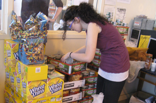 
                    Ashley Fisher collecting food to fill a prisoner's order.
                                            (Nancy Mullane)
                                        