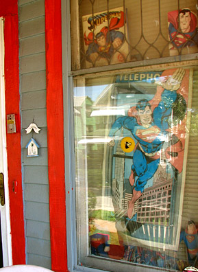 
                    The front window of the Grays' house is decorated with Superman memorabilia the Grays have collected or received as gifts over the years.
                                            (Mhari Saito)
                                        