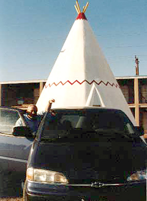
                    Donn Keith at the helm of the Keith Family minivan in front of the Route 66 Wigwam Hotel in Holbrook, Ariz.
                                            (Tamara Keith)
                                        