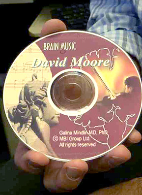 
                    Brain Music Therapy, or BMT, is a personalized composition created using a patient's own brain waves. Pictured here is Weekend America guest Dr. David Moore's brain music CD, which he uses for sleep apnea. Patients' names are printed on each disc.
                                            (Jim Gates)
                                        