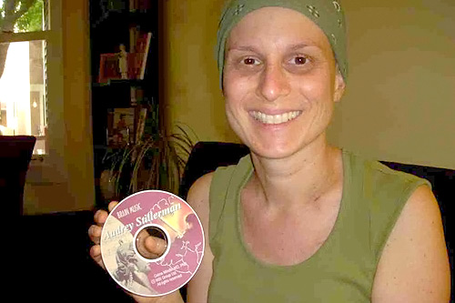 
                    After being diagnosed with stage two breast cancer, numerous rounds of chemotherapy and an intense medication regimen, Audrey Stillerman was restless, anxious and unable to sleep. Dr. Moore prescribed BMT for Stillerman, who is pictured here holding her personalized CD.
                                            (Jim Gates)
                                        