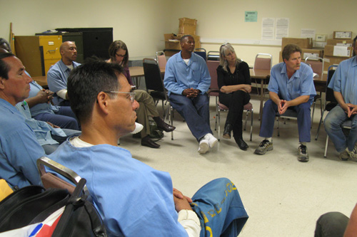 
                    Inmates listen to Jaimee Karroll speak at a meeting of the Insight Prison Project at San Quentin State Prison.
                                            (Nancy Mullane)
                                        