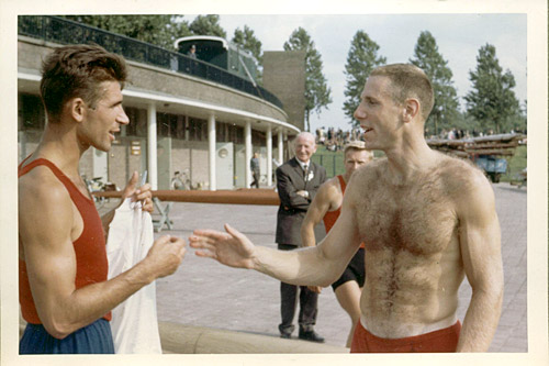 
                    Don Spero gives Vyacheslav Ivanov his shirt after losing his first race against him in August, 1964 at the European Championships in Amsterdam, and two months before the two men faced off again at that year's Olympic Games in Tokyo.   Spero was ahead by a length of 500 meters. As  predicted, Ivanov beat him by a length and Spero spent the next two months learning to sprint in preparation for Tokyo.
                                            (Courtesy Don Spero)
                                        