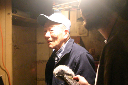 
                    Sano in the room where his family once dried laundry that had been washed.
                                            (Dominic Amorosia)
                                        