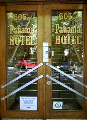 
                    The entrance to the Panama Hotel. These are the original doors. Jan found an old sign and used its lettering as the model for the new lettering on the doors.
                                            (David Weinberg)
                                        