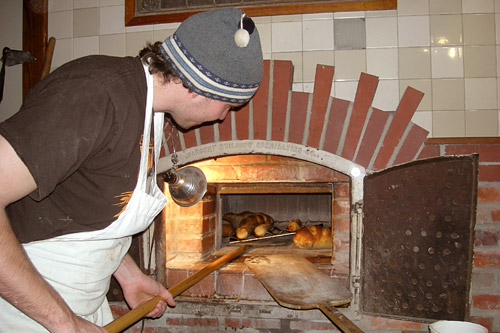 
                    Pictured here is the handmade, wood-fired brick oven at the Back Alley Bakery in Hastings, Neb. It cooks bread at 600 degrees, giving it a crunchy, light brown crust.
                                            (Martin Wells)
                                        