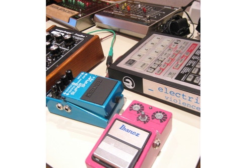 
                    Effects Collection: Elliot Bergman's arsenal of effects pedals.  After amplifying his homemade instruments, he uses the pedals to further alter the sound.
                                            (Angela Kim)
                                        