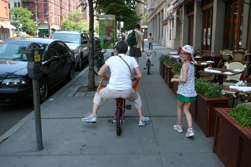 
                    Fiona Hinds, age eight, appreciating the biking technique of her grandmother, Eleanor Katz.
                                            (Kate Hinds)
                                        