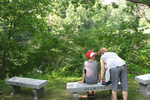 
                    Hikers rest on the new bench purchased by the Diamond family. The Diamonds grew fond of Lake View Cemetery after participating in community events.
                                            (Mhari Saito)
                                        
