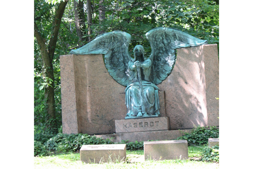
                    Lake View Cemetery's famous "weeping" angel sits in front of the wooded area where the new nature trail has been laid.
                                            (Mhari Saito)
                                        