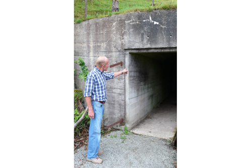 
                    My cousin Kolbjorn Ladstein points out the tunnel Nazis built on Finnoy during WWII. The Nazis mined the Stavanger fjord and used the island as a look-out.
                                            (Leif Larsen)
                                        