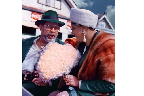 
                    Edwin and Rose Harrison as King and Queen of the Moneywasters Social Aid and Pleasure Club Parade in December, 1991. The couple was flown into the parade via helicopter and driven in a white, horse-drawn carriage. Curt had no idea about Edwin's colorful, prominent life in New Orleans until Edwin entrusted him to restore his pictures and videos.
                                            (Curt Peters)
                                        