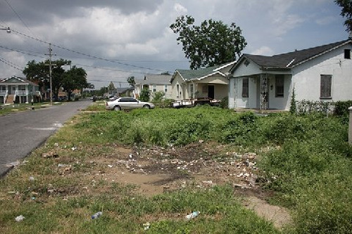 
                    This is a long view of Mr. Harrison's street, which was flooded during Hurricane Katrina. The homes are still in various stages of repair.
                                            (Curt Peters)
                                        
