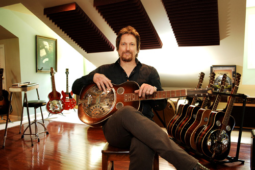 
                    Jerry Douglas and one of his Dobros.  Dobro is short for "Dopyera Brothers," the name of the brothers who added modifications to a regular guitar to create the Dobro.
                                            (Courtesy Jerry Douglas)
                                        