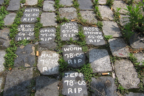 
                    Yong Lee painted each cobblestone with the kind of white paint you'd use to paint the exterior of a house. Most of the names listed on the memorial are either just nicknames or first names.
                                            (Jonathan Menjivar)
                                        
