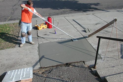 
                    Preparing the sidewalk for the poem to be impressed.
                                            (Chris Roberts)
                                        