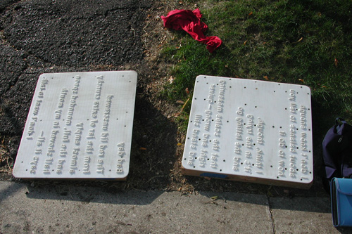 
                    The poem molds for "Bad day" by Caley Conney and "Tipping the Scales" by Georgia A. Greeley wait by the edge of the sidewalk.
                                            (Chris Roberts)
                                        