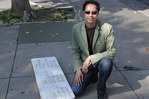 
                    Marcus Young, Saint Paul's Artist-in-Residence, with   a poem mold.  Young thought up the "Everyday Sidewalk Poetry" project as he was walking down the sidewalk one day.
                                            (Chris Roberts)
                                        