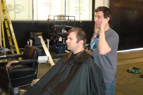 
                    Michael Anthony cuts reporter Charlie Schroeder's hair.
                                            (Tim Bomba)
                                        