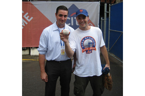 
                    Zack Hample poses with a baseball authenticator after he caught the last home run ever hit by a New York Met at Shea Stadium.
                                            (Courtesy Zack Hample)
                                        