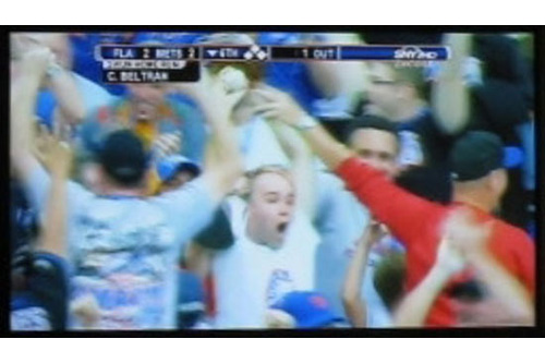 
                    Zack goes nuts after catching Carlos Beltran's home run at Shea Stadium.
                                            (Courtesy Zack Hample)
                                        