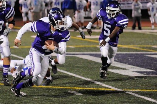 
                    The Piedmont High quarterback Jeremy George on the run.
                                            (Pat Krausgrill/Piedmont Post)
                                        