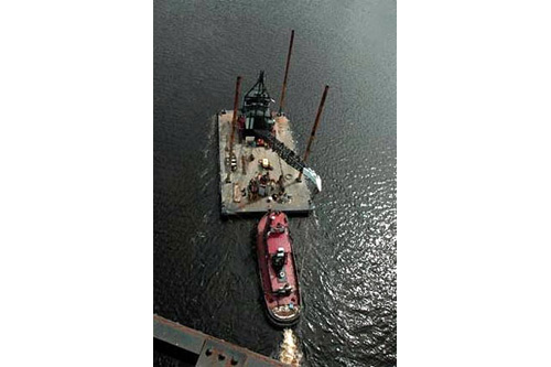 
                    The Jordan Bridge has been destroyed a few times in the past by ships crashing into it. In 2004, a crane barge pushed by a tugboat knocked out a chunk of its draw span.
                                            (Janos Enyedi)
                                        