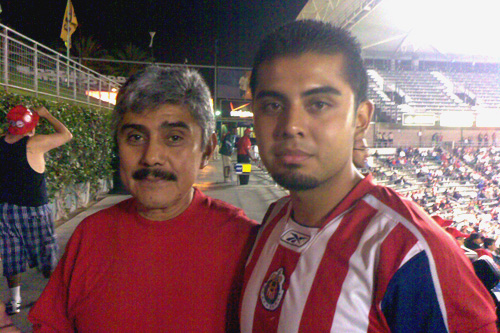 
                    Father and son, Paco and "Knuckles," are longtime Chivas Guadalajara supporters.
                                            (Charlie Schroeder)
                                        