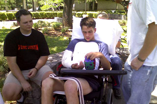 
                    Justin Logan with his brothers, Brandon (left) and Derick (standing).
                                            (Danette Overstreet)
                                        