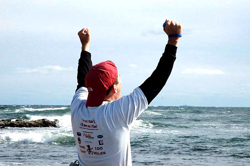 
                    John stands on a rock and looks out to sea.  He's run across New Hampshire in 30 hours and 51 minutes.
                                            (Sarah Chretien)
                                        