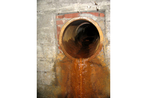 
                    Toxic residue filters down from gutterboxes into the drain tunnels.
                                            (Adam Allington)
                                        