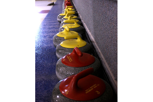 
                    A line of stones (aka "rocks") settles on the ice. The St. Paul Curling Club just bought eight new sets of stones, which set them back over $80,000.
                                            (Marc Sanchez)
                                        
