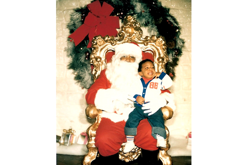 
                    Desiree Cooper's son Jay, now 21, on a black Santa's knee.
                                            (Courtesy Desiree Cooper)
                                        
