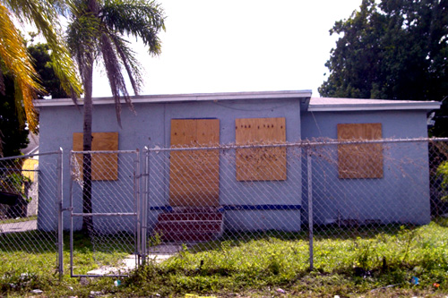 
                    Abandoned homes like this one are a common sight in Miami's impoverished Liberty City neighborhood.
                                            (Andrew Stelzer)
                                        