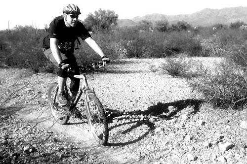 
                    Charles Wommack biking through Tucson Mountain Park.  It was his second ride back on his mountain bike.
                                            (Courtesy Charles Wommack)
                                        