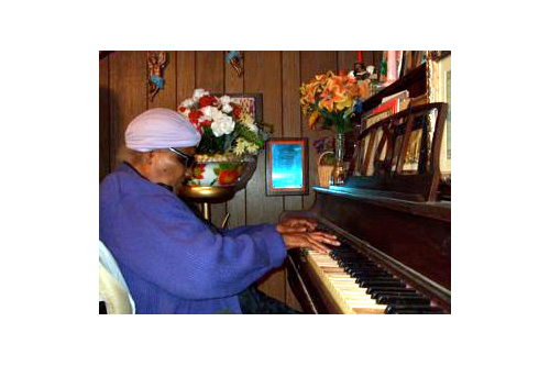 
                    Fleta "Mother" Mitchell at the piano.
                                            (Philip L. Graitcer)
                                        