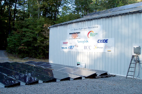 
                    Mike Strizki's solar array next to and on top of garage.  Company listings on the side are contributors to the project.
                                            (Eugene Sonn)
                                        